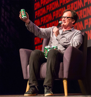 Will this start a trend for VB fans? Quentin Tarantino with his personalised Victoria Bitter cans designed and produced by Orora.